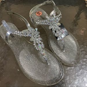 Clear/silver rhinestone sandals.